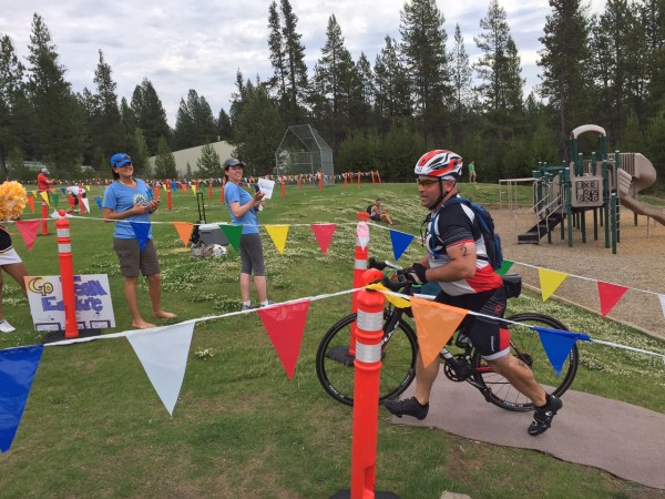 Nick, done with the bike, coming in to tag Ben back in for the final leg.